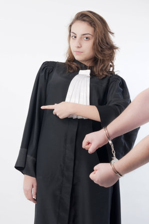 Young lawyer  sentencing a guilty personの写真素材