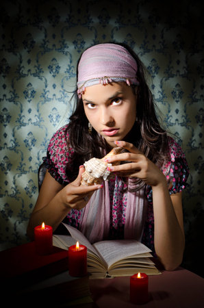 Young woman playing fortune-tellerの写真素材