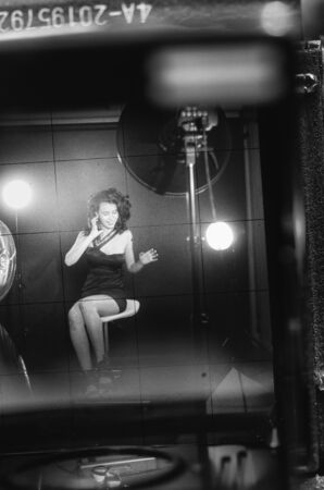 young girl photographed through an old camera viewfinder