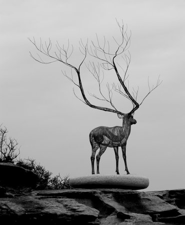 Sculpture of deer on rock platformの写真素材