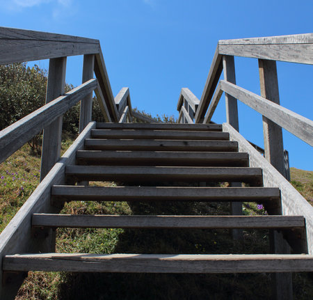 Outdoor wooden stairs against blue skyの写真素材