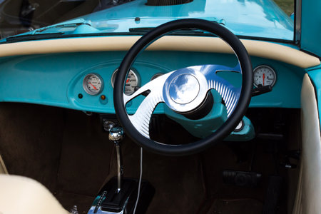 Aqua vintage sports car interior steering wheel