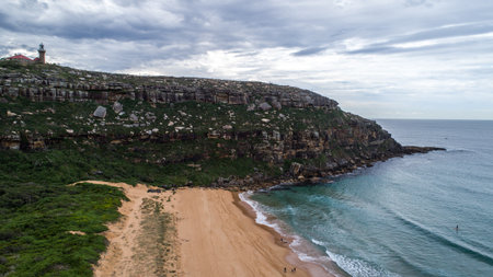 Aerial view of Barrenjoey lighthouse atop headland at Palm Beach, Sydney Australia