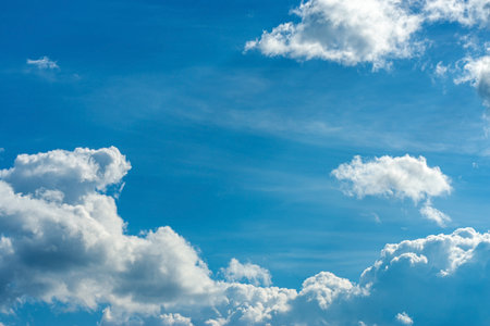 Blue sky white clouds. Puffy fluffy white clouds. Summer blue sky time lapse. Nature weather blue sky. White clouds background.の写真素材