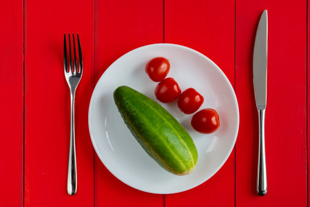 Plate and cutlery on the table. Fork and knife on an empty plate. Suitable for Vegetarians. close-up image. diet concept.の写真素材
