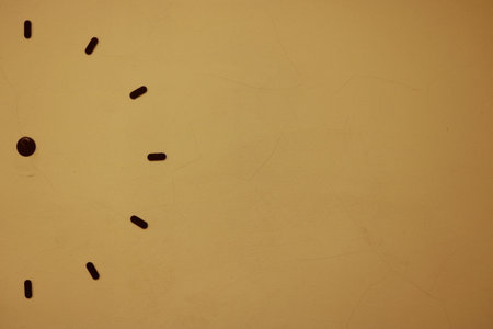 Half clock on the old wall or crack wallの写真素材