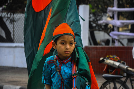 Dhaka, Bangladesh, 21 February 2018: An image of a little flag seller in Dhaka, Bangladesh.のeditorial素材