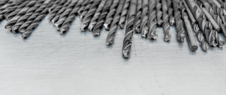 Metal tools. Metal style. Drills on the scratched metal background.の写真素材
