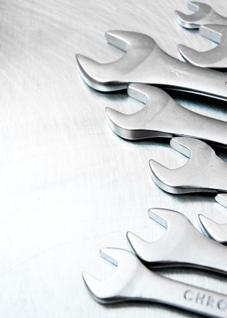 Metal style. Wrenches on the scratched metal background.の写真素材