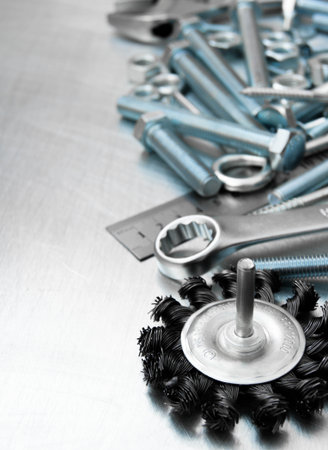Metal tools. Metal style. Grinding circle and other tools on the scratched metal background.の写真素材