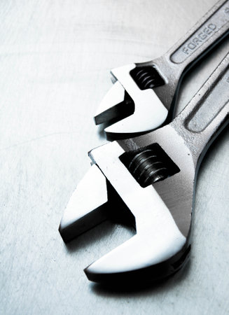 Metal tools. Metal style. Wrench on the scratched metal background.の写真素材