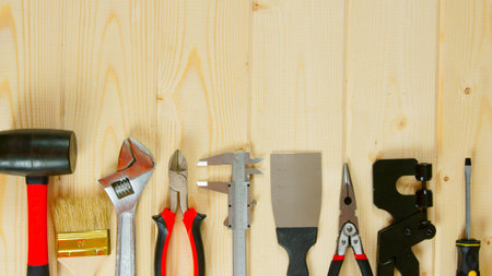 Working tools. Many working tools on a wooden background.