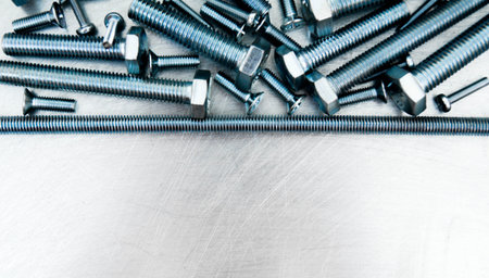 Metal working tools. Metal style. Hairpin and other fixing elements on the scratched metal...
