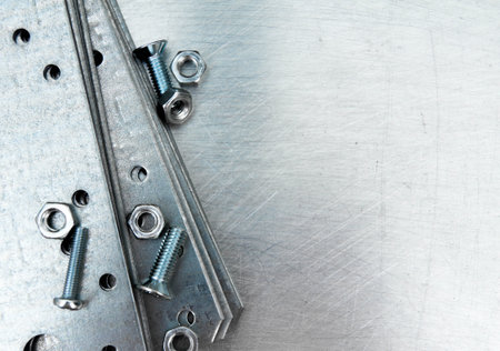 Metal working tools. Metal style. Metal preparations and fixing elements on the scratched metal...