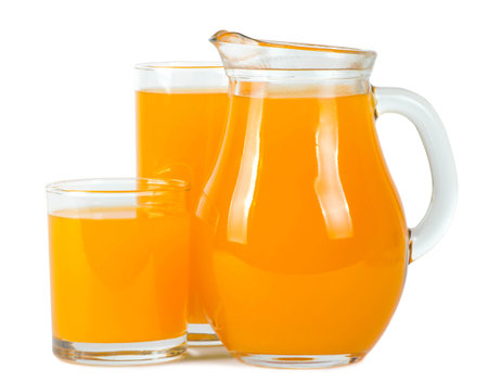 Orange juice in the glasses and the pitcher . Isolated on a white background.の写真素材