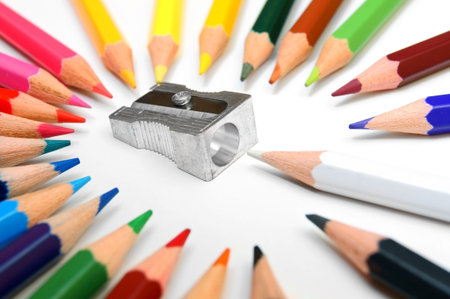 Sharpener and pencils on a white background.の写真素材