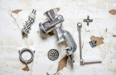 Disassembled manual grinder. On the rustic background. Top viewの写真素材