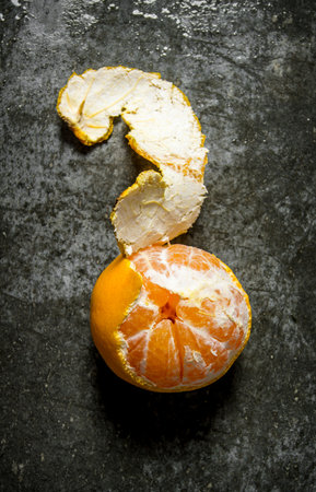Fresh tangerines with peel. On a stone background. Top viewの写真素材