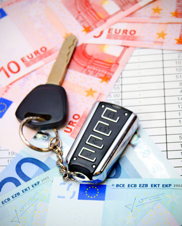 Key from the car and euro. On documents.の写真素材