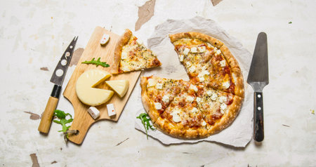Cheese pizza with herbs and fresh cheese. On rustic background. Top viewの写真素材