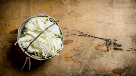 Fresh cabbage in the old pot. On wooden background.の写真素材