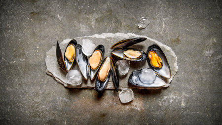 Clams with ice on a stone stand. On the stone table. Top view