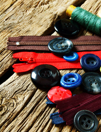 Sewing background. Sewing accessories on wooden background