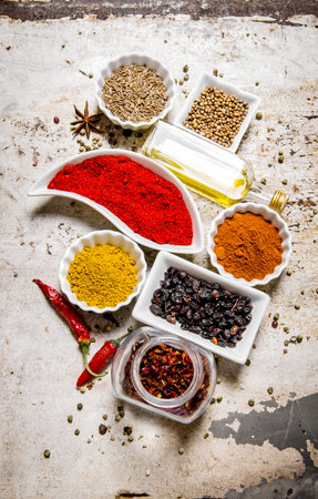 Set of colorful spices and herbs. On the rustic background. Top viewの写真素材
