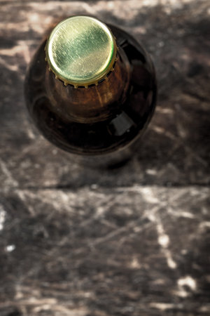 bottle of fresh beer. On a wooden background.の写真素材