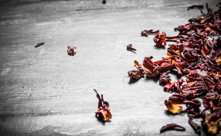 Dried pomegranate tea. On a black wooden background.の写真素材