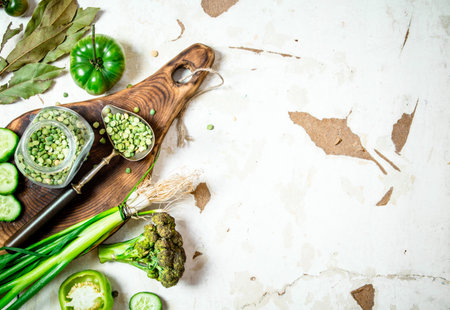 Healthy food. Green vegetables and herbs. On rustic background .の写真素材
