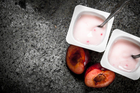 Natural yogurt in a bowl. On a rustic background.の写真素材