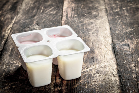 Fruit fresh yoghurt. On a wooden background.の写真素材