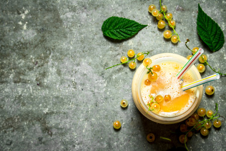 Smoothie made from white currants . On a stone background.の写真素材