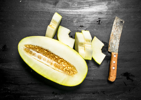 Fresh ripe melon. On the black chalkboard.の写真素材