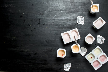 Yogurt with fresh fruit. On the black chalkboard.