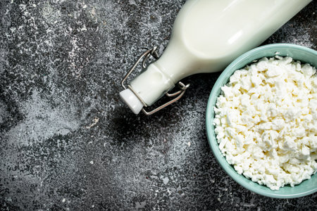 Cottage cheese and natural cow milk. On a rustic background.の写真素材
