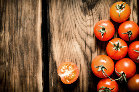 Fresh red tomatoes . On a wooden background.の写真素材