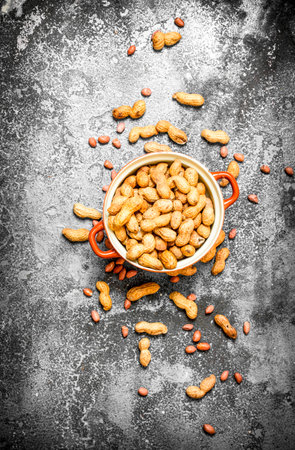 Peanuts in a bowl. On rustic background.の写真素材