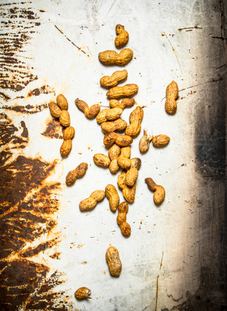 Peanuts in the shell. On rustic background.