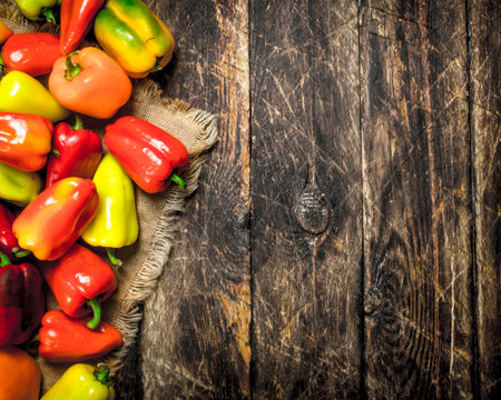 Sweet colorful pepper. On a wooden background.の写真素材