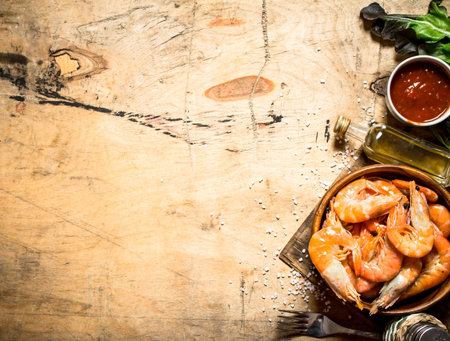Fresh shrimp with sauce. On a wooden table.の写真素材