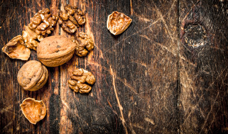 Walnuts. On wooden background. Free text spaceの写真素材