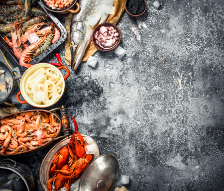 Different fresh seafood. On a rustic background.の写真素材
