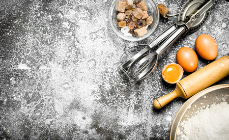 Baking background. Ingredients and tools for dough preparation. On a rustic background.の写真素材