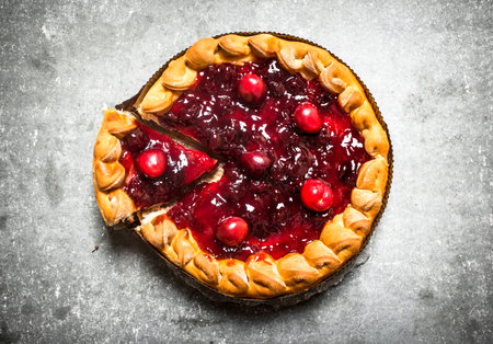 Cherry pie with jam. On the stone table.の写真素材