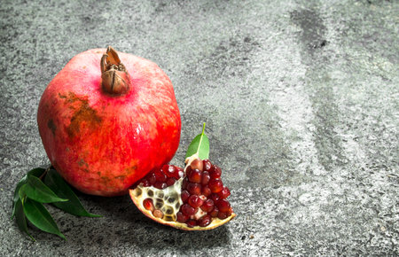 Ripe fresh pomegranate. On a rustic background.の写真素材