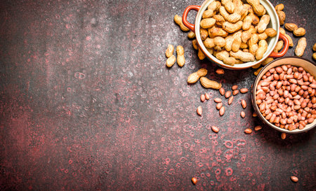 Peanuts in a bowl. On rustic background.