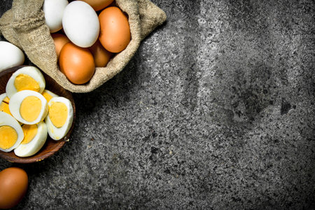 Boiled eggs in a bowl. On a rustic background.の写真素材