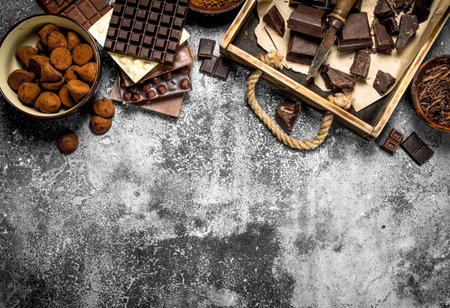Different chocolate with truffles. On a rustic background.の写真素材